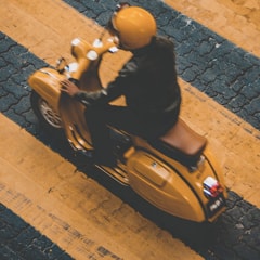 there is a photo of a user traveling on a scooter